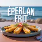 Assiette d'éperlan frit doré croustillant sur table en bord de mer